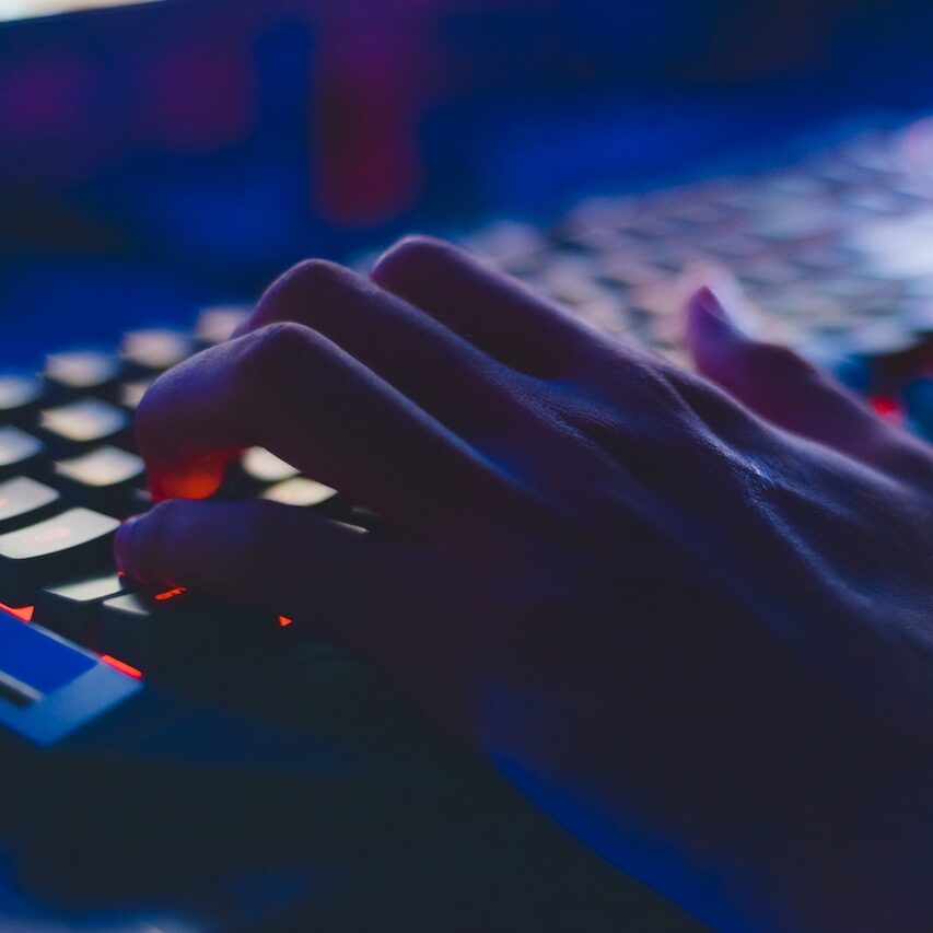 Close up of a person typing on a keyboard to learn more about Carbonite auto backup.